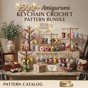 May include: A digital collection of 1500+ Amigurumi keychain crochet patterns for 2026. The image displays various crocheted animal and food keychains hanging on wooden stands, a wooden box with small figures, a gift box, and a basket of yarn.
