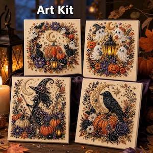 May include: Four square diamond painting canvases labeled Art Kit, featuring Halloween themes including pumpkins, ghosts, a witch, a black cat, and a raven, all decorated with colorful beads and floral accents on a light background.
