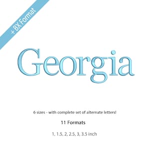 May include: Light blue embroidered text of the name "Georgia" on a white background. The text is in a serif font. Below the name are the words "6 sizes - with complete set of alternate letters!" and "11 Formats". The sizes are listed as 1, 1.5, 2, 2.5, 3, 3.5 inch.