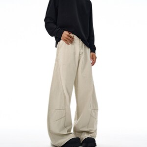 Drapey Baggy Pants | Casual Wide Leg Trousers | Daily Wear | Y2K Streetwear Style

Drapey baggy pants with wide leg design featuring loose fit silhouette and panel seam detailing, styled as casual trousers for daily wear and streetwear outfits with relaxed structure and comfortable movement
