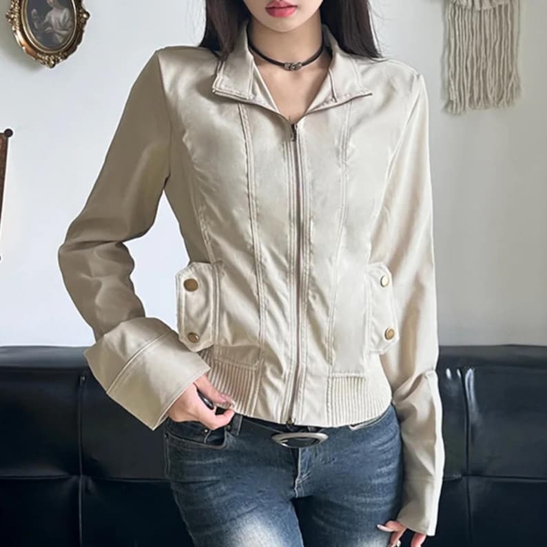 Women's Slim Fit Jacket | Casual Zipper Coats | Solid Streetwear Winter Fashion

Women wearing a slim-fit zippered jacket with long sleeves and a structured shape, styled with low-rise jeans for a modern streetwear look.