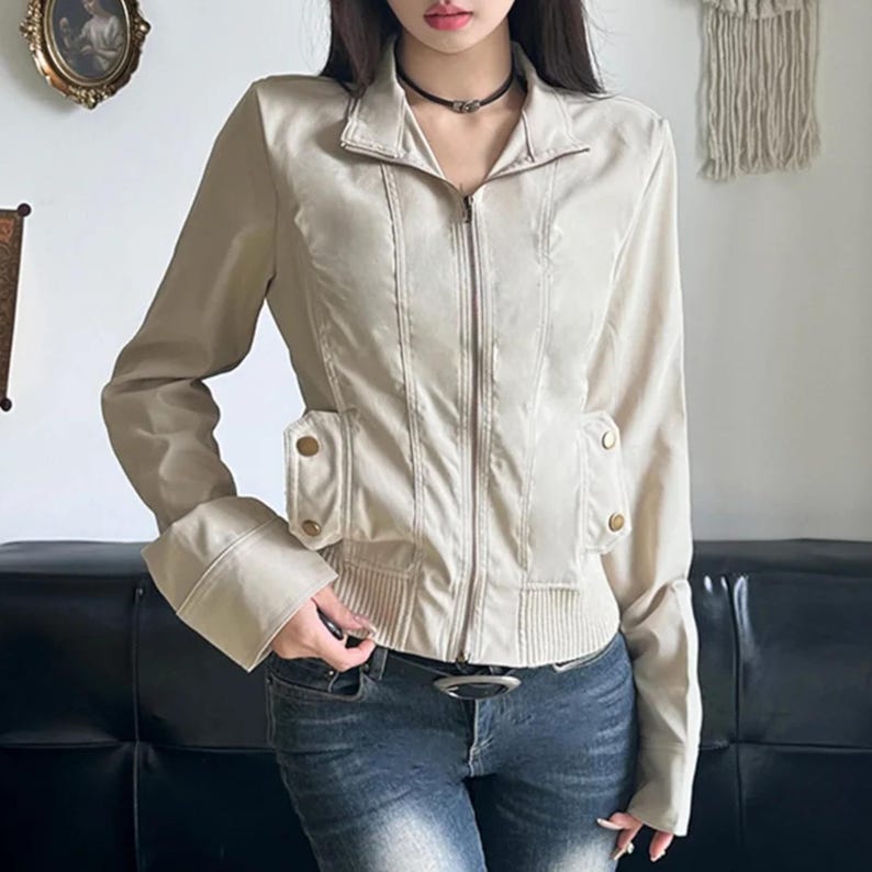 Women's Slim Fit Jacket | Casual Zipper Coats | Solid Streetwear Winter Fashion

Women wearing a slim-fit zippered jacket with long sleeves and a structured shape, styled with low-rise jeans for a modern streetwear look.