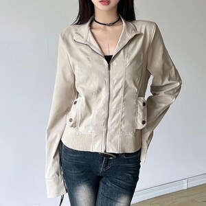 Women's Slim Fit Jacket | Casual Zipper Coats | Solid Streetwear Winter Fashion

Women wearing a slim-fit zippered jacket with long sleeves and a structured shape, styled with low-rise jeans for a modern streetwear look.