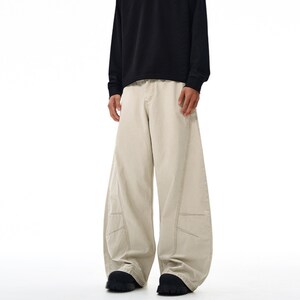 Drapey Baggy Pants | Casual Wide Leg Trousers | Daily Wear | Y2K Streetwear Style

Drapey baggy pants with wide leg design featuring loose fit silhouette and panel seam detailing, styled as casual trousers for daily wear and streetwear outfits with relaxed structure and comfortable movement