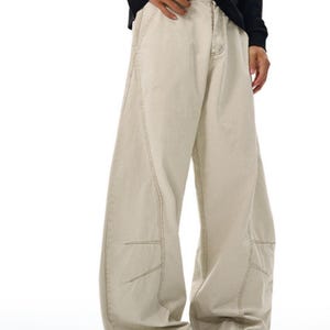 Drapey Baggy Pants | Casual Wide Leg Trousers | Daily Wear | Y2K Streetwear Style

Drapey baggy pants with wide leg design featuring loose fit silhouette and panel seam detailing, styled as casual trousers for daily wear and streetwear outfits with relaxed structure and comfortable movement