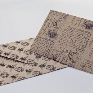 May include: Two decorative envelopes. One envelope features a repeating pattern of black insects and postage stamp designs on a tan background. The other envelope has a vintage script and postage stamp design on a tan background.