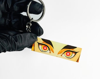 Llavero de ojos brillantes de Kyojuro Rengoku / Llavero compatible con anime / Llavero de Demon Slayer Flame Hashira