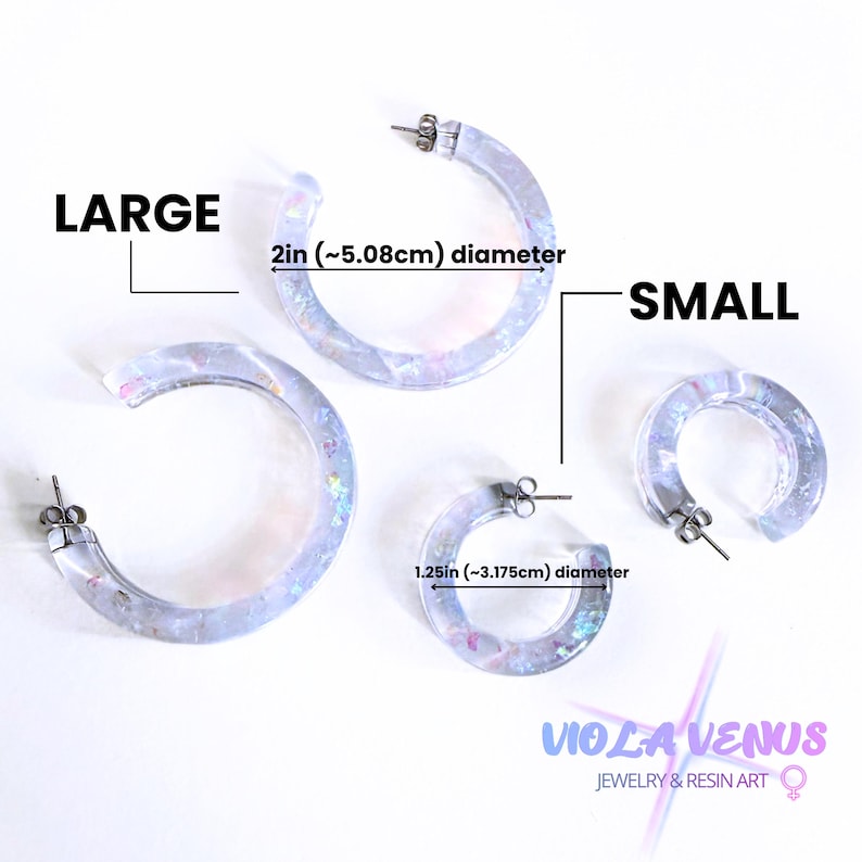 May include: Two pairs of translucent hoop earrings with iridescent flakes. The large pair has a 2-inch diameter, and the small pair has a 1.25-inch diameter. The image includes the text LARGE, SMALL, and VIOLA VENUS JEWELRY & RESIN ART.