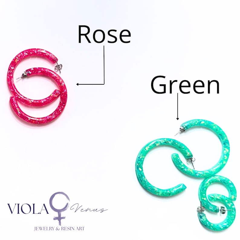 May include: Two pairs of circular hoop earrings with a glittery finish. One pair is bright rose pink, and the other is vibrant green. The text Rose and Green labels each pair, and the logo VIOLA Venus JEWELRY & RESIN ART is at the bottom.
