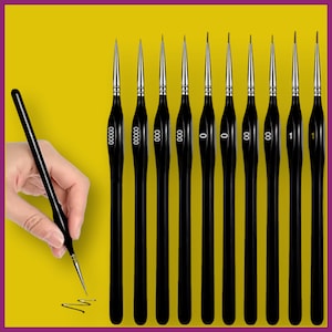 May include: A set of black handled detail paint brushes with silver ferrules and fine tips. The brushes are arranged in a row against a yellow background. The brush sizes are labeled with numbers and zeros.