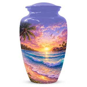 May include: A lavender cremation urn with a scenic beach sunset design. The artwork depicts a tropical beach scene with palm trees, ocean waves, and a vibrant sunset. The urn is a decorative memorial for ashes.