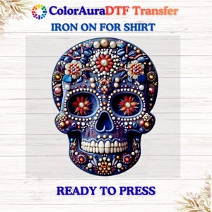 May include: A detailed, colorful skull design with floral and pearl accents. The skull is dark blue with red, orange, and white embellishments. Text at the top reads "ColorAuraDTF Transfer IRON ON FOR SHIRT" and at the bottom "READY TO PRESS".