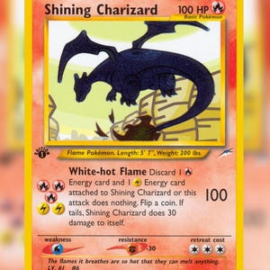 May include: A Shining Charizard trading card with 100 HP, featuring a dark blue dragon illustration, fire energy symbols, and text detailing the White-hot Flame attack. The card includes a 1st Edition stamp, level 61, and a 107/105 collector number.