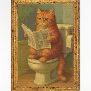 May include: Framed artwork featuring an orange tabby cat sitting on a toilet and reading a newspaper. The cat is the focal point, with a vintage-style toilet and a roll of toilet paper visible. The frame is gold-colored.