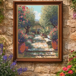 May include: A framed artwork depicting a garden scene with a stone pathway, lush greenery, and vibrant red and pink flowers. The artwork is in a brown wooden frame, set against a textured stone wall, with potted plants in the foreground.