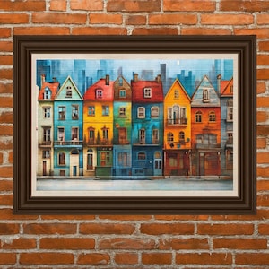 Puede incluir: Una impresión enmarcada que presenta una fila de casas coloridas. Las casas están pintadas en tonos vibrantes de azul, amarillo, rojo y naranja. La obra de arte está ambientada sobre un fondo de paisaje urbano y un cielo claro. El marco es de color marrón oscuro.