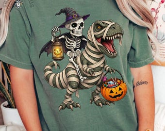 Skeleton Riding T Rex Halloween Shirt, Comfort Colors Long Sleeve Mummy Dinosaur Tee, Spooky Halloween T-Shirt Gift