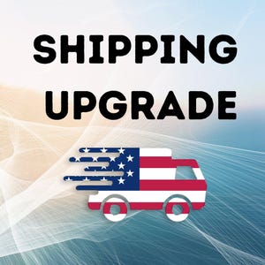 May include: Image with the words "SHIPPING UPGRADE" in bold black letters. Below the text is a graphic of a delivery truck with the American flag design, including stars and stripes, and motion lines.