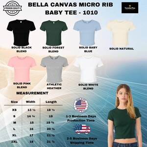 May include: Bella Canvas 1010 micro rib baby tees in solid black, forest, baby blue, natural, pink, athletic heather, and white. Includes a size chart with width and length measurements in inches, a Made in USA badge, and a model wearing the forest green shirt.