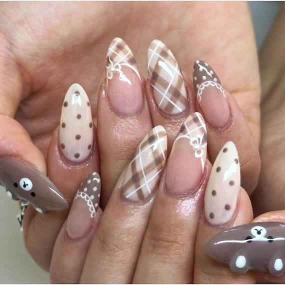 20 Thanksgiving Nail Ideas for a Festive Fall Manicure 12 Neutral Plaid and Bows