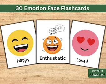 May include: Set of three emotion face flashcards with the words "Happy", "Enthusiastic", and "Loved". Each card features a different emoji face with corresponding expressions. The cards are on a wooden surface.