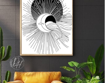 Puede incluir: Lámina de arte celestial en blanco y negro con una luna creciente, un sol y estrellas. La obra de arte está enmarcada en un marco de madera clara y cuelga sobre un sillón amarillo. El diseño incluye líneas radiantes y un patrón de ondas.