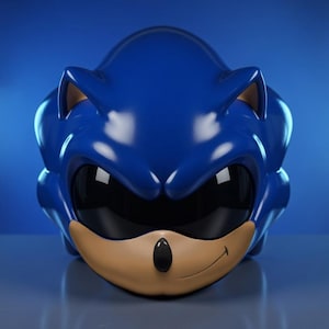 May include: A blue helmet shaped like the head of a cartoon hedgehog. The helmet has black eye coverings, a tan muzzle, and a black nose. The helmet is sitting on a blue surface.