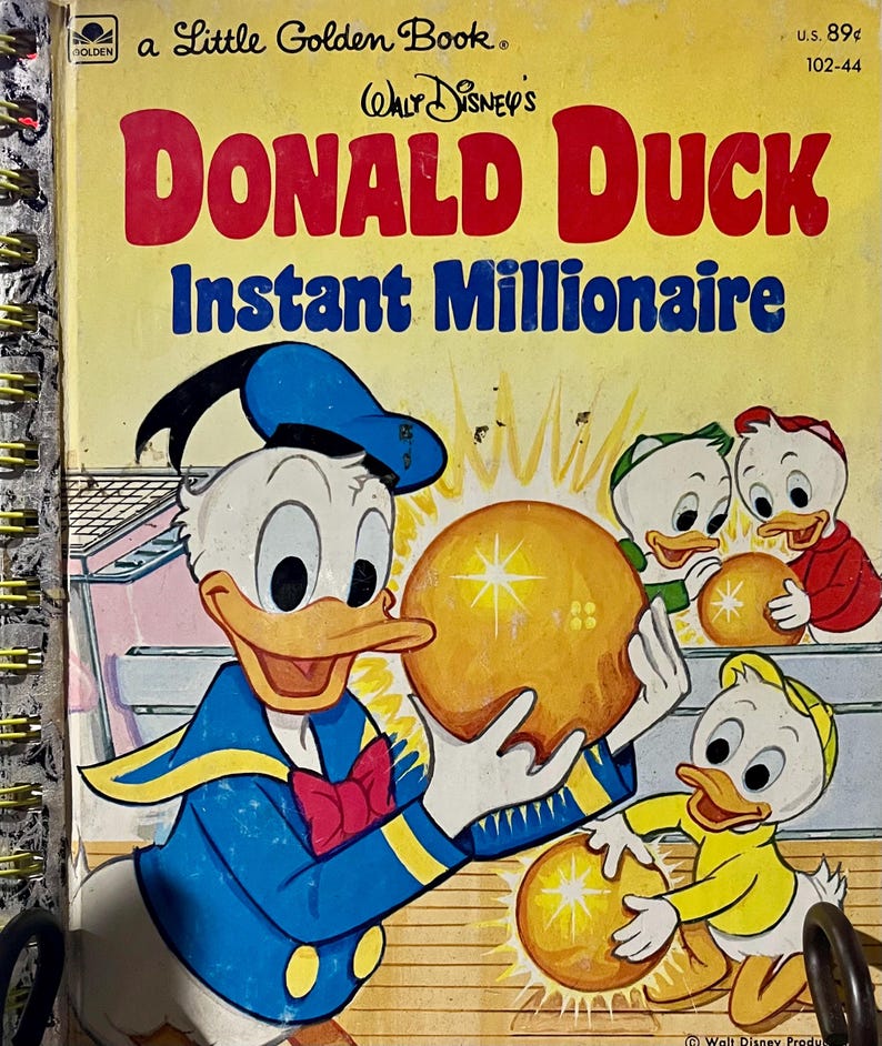 May include: A Little Golden Book titled Walt Disney's Donald Duck Instant Millionaire. The yellow cover features Donald Duck and three ducklings holding glowing golden spheres. The title is printed in large red and blue lettering.