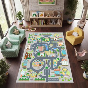 May include: A gray play mat with a town design featuring roads, houses, trees, and vehicles. The mat is rectangular and designed for children's play. The houses are colorful, and the roads are gray.