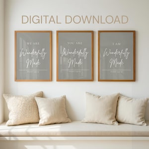 Pode incluir: Três impressões emolduradas com o texto "WE ARE", "YOU ARE" e "I AM Wonderfully Made" em escrita elegante. As impressões estão em molduras de madeira com um fundo cinza. O texto "DIGITAL DOWNLOAD" está no topo.