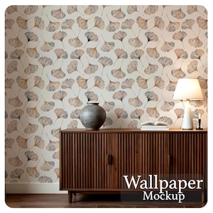 May include: A room interior featuring a wallpaper with a repeating ginkgo leaf pattern in shades of brown and black on a cream background. A wooden cabinet, a lamp, and a vase are in the foreground. The text "Wallpaper Mockup" is at the bottom.