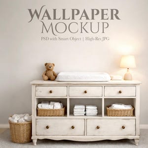 May include: A distressed white dresser with a changing pad, teddy bear, and lamp. Wicker baskets contain folded items. The text "WALLPAPER MOCKUP" is above the dresser.