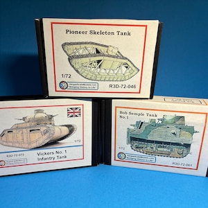 May include: Three model boxes with illustrations of historical tanks. The boxes are labelled "Pioneer Skeleton Tank", "Vickers No. 1 Infantry Tank", and "Bob Semple Tank No. 1". Each box includes the scale 1/72.