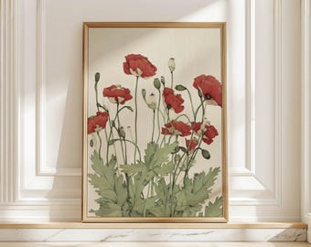 Puede incluir: Una impresión artística enmarcada que presenta una ilustración botánica de amapolas rojas con hojas y tallos verdes. La obra de arte está sobre un fondo crema y enmarcada en un marco dorado. La impresión se exhibe en una repisa de mármol.