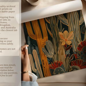 Hand-drawn cactus art print in black, mustard, teal and rust, warm earthy mood; art print being unrolled on a neutral tabletop by two hands with overlay text about archival pigment printing, 200gsm matte paper and secure packaging.