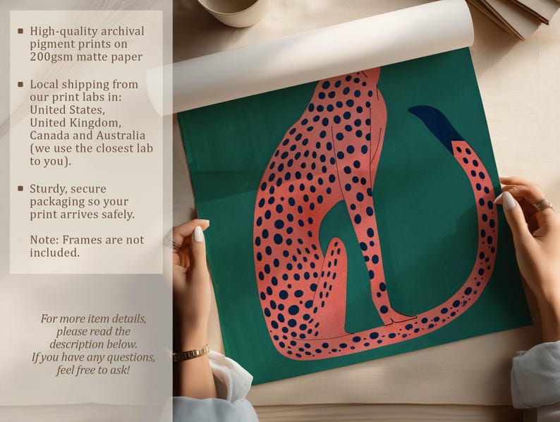 Bold art print of a pink cheetah on teal being unrolled on a neutral tabletop, with hands visible and overlay text about archival pigment printing and secure packaging.