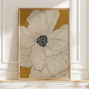 Large white linework flower on mustard yellow background, modern minimalist mood, framed poster leaning on a marble ledge against a white paneled wall.
