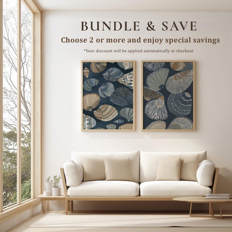 Coordinated 2-piece set of navy and beige seashell illustration art prints with striped textures and a calm coastal mood, displayed as a matching gallery wall pair above a sofa.