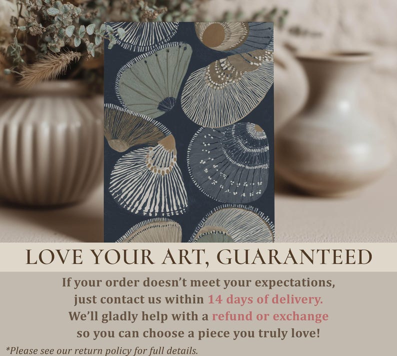 Elegant navy-and-beige seashell wall art print with striped shell details and a serene coastal feel, styled on a tabletop with blurred vases and a guarantee overlay.