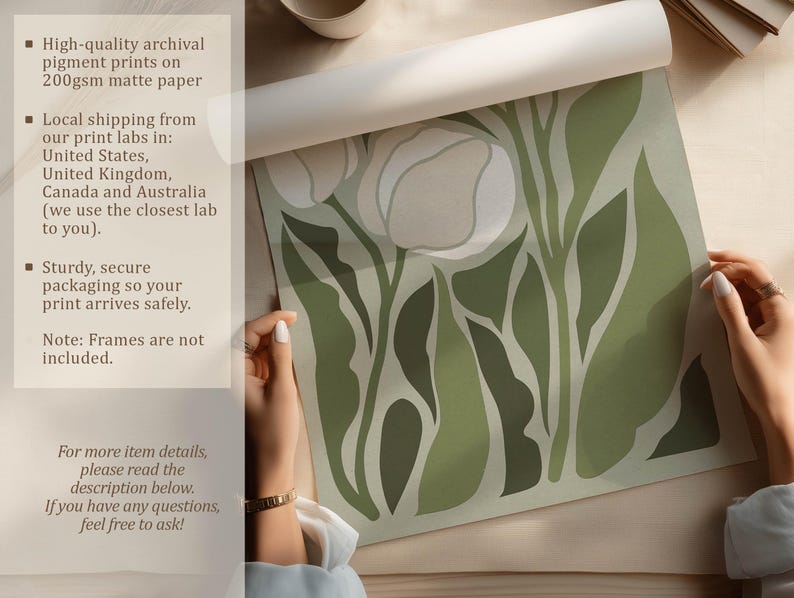 Hand-rolled tulip art print in soft sage and cream shown on a neutral tabletop being unrolled by two hands, with overlay text about archival pigment printing and matte paper.