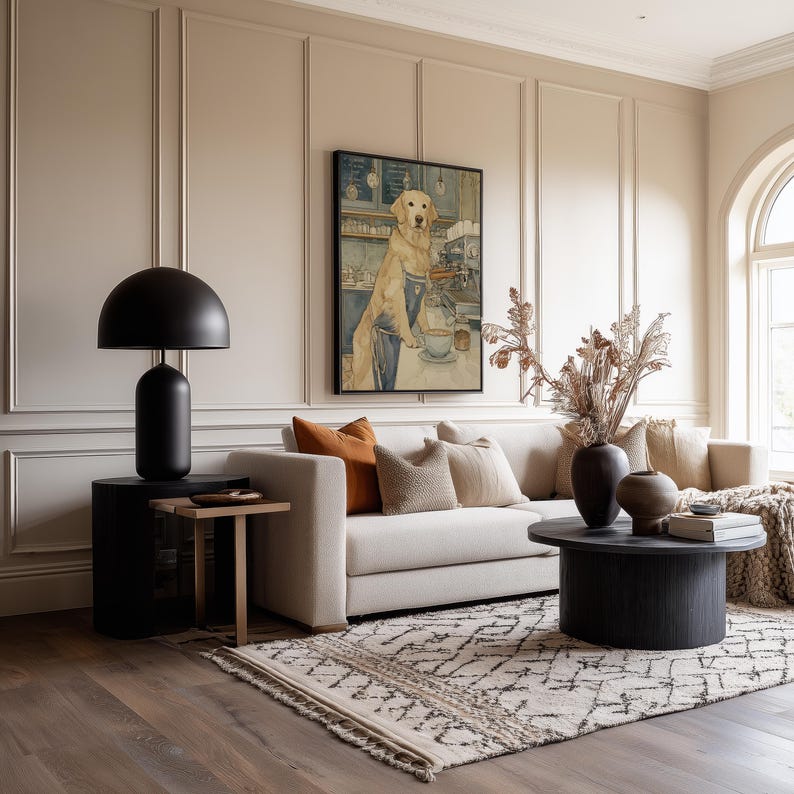 Calm watercolor dog poster above a beige sofa in a warm living room with paneled walls, patterned rug and earthy decorative vases.