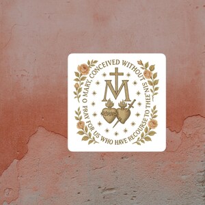 May include: Square sticker with religious imagery. The design features a cross, the letter M, two hearts, and text that reads "O Mary, conceived without sin, pray for us who have recourse to thee." The design is framed by floral elements.