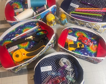 Handmade quilted zippered pouches open to create shallow trays.