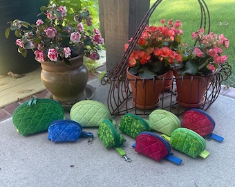 Handmade quilted zippered pouches.