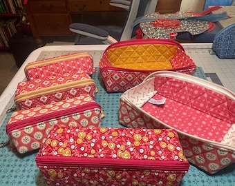 Handmade Americana collection quilted zippered pouches open to create shallow trays.
