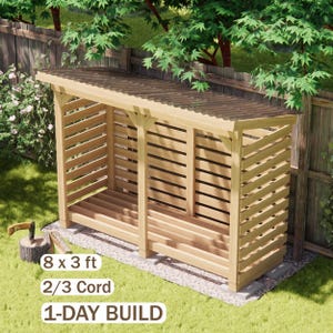 May include: A light brown wooden firewood storage shed with a slatted design, a slanted roof, and a raised base. The structure features text labels reading 8 x 3 ft, 2/3 Cord, and 1-DAY BUILD. It is positioned outdoors on a gravel and grass surface.