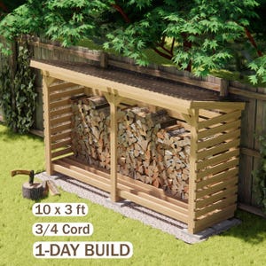 May include: A wooden firewood storage shed with a sloped roof and slatted sides, filled with stacked logs. Text on the image reads 10 x 3 ft, 3/4 Cord, and 1-DAY BUILD. An axe rests on a small log stump nearby on the grass.