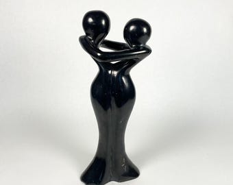 Vintage Mid Century High Gloss Black Porcelain Humans Embracing Figurine
