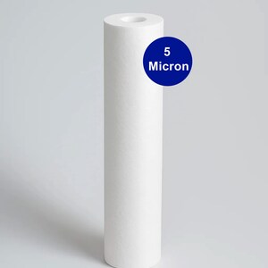 May include: A white cylindrical water filter with a flat top and a hole in the center. A blue circle with the text "5 Micron" is on the right. The brand name "CAR-FIL" is in a black rectangle at the top.