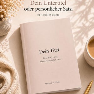 May include: A light pink notebook with black text on the cover reading "Dein Titel," "Dein Untertitel oder persönlicher Satz," and "optionaler Name." The notebook is displayed with a gold pen, a ceramic mug, and a vase of dried flowers.